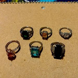 Here’s 6 beautiful RINGS, all size 7, costume jewelry, diff shapes (COSTUME).